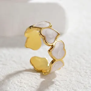 Vintage gold-plated stainless steel open ring with heart-shaped white enamel inlays