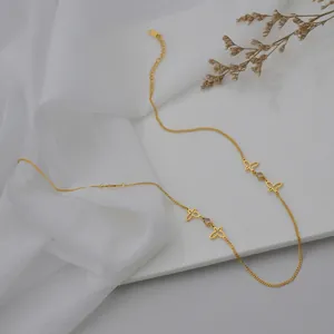 Minimalist gold butterfly stainless steel necklace with sparkling rhinestones on silk