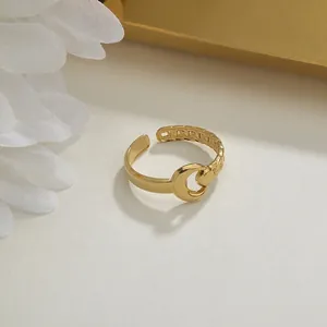 Minimalist adjustable gold ring with crescent moon design and delicate chain texture