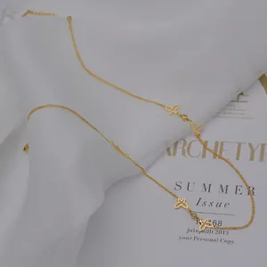 Elegant gold stainless steel necklace with hollow butterfly charms and zircon accents
