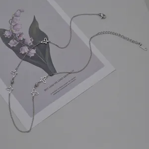 Elegant silver stainless steel necklace with hollow butterfly charms and zircon details