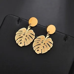 Vintage gold monstera leaf dangle earrings in polished stainless steel for women