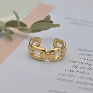 Adjustable golden stainless steel chain link open ring with a minimalist industrial design