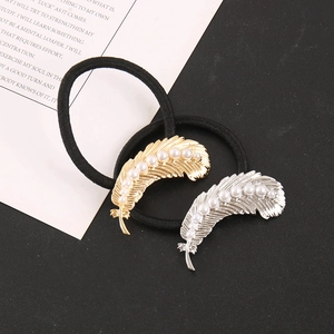 Elegant feather hair ties with white pearls in gold and silver finish on elastic bands