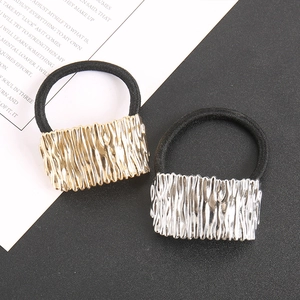 Detail of irregular texture alloy hair ties in gold and silver with high elastic bands
