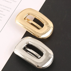 Close-up of sleek hollow rectangular hair clips in polished gold and silver alloy finish