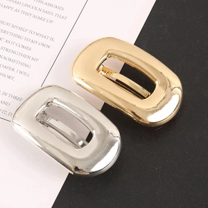 Minimalist alloy hair clip set in gold and silver with elegant oval hollow design