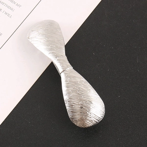 Elegant silver metal hair clip with brushed texture and minimalist geometric bow design
