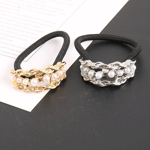 Set of two woven pearl hair ties in gold and silver finish with black elastic bands