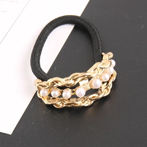 Elegant black elastic hair tie featuring layered gold chains and white faux pearls