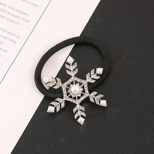 Vintage snowflake hair tie featuring alloy accents with rhinestones and faux pearls