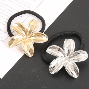 Elegant gold and silver floral metal hair ties with black elastic bands for stylish ponytails