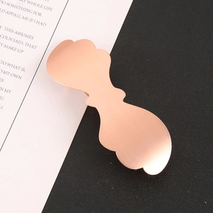 Elegant rose gold wave hair clip with brushed metal finish for stylish hair styling