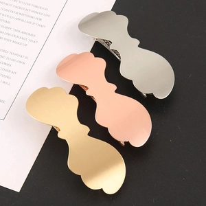 Detailed view of three-color irregular wave hair clips in matte gold, rose gold, and silver