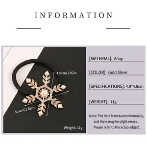 Fashionable gold snowflake hair tie with rhinestones and pearls on black elastic band