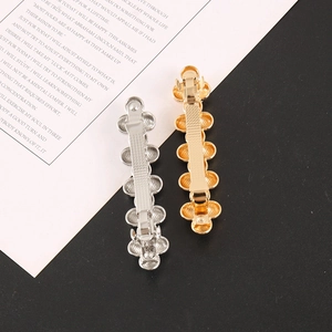 Detail view showing spring clip mechanism and texture of flower hair clips