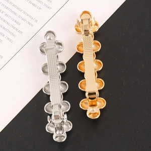 Elegant beaded metallic hair clip with wavy disc pattern in gold and silver finish