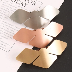 Detailed view of geometric bird-shaped alloy hair clips in gold, silver, and rose gold