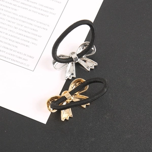 Elegant gold and silver metallic bow hair ties with black elastic bands for women