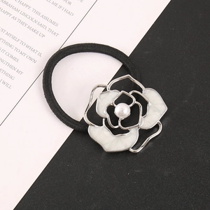 Elegant Camellia hair tie with white enamel petals, silver border and pearl center