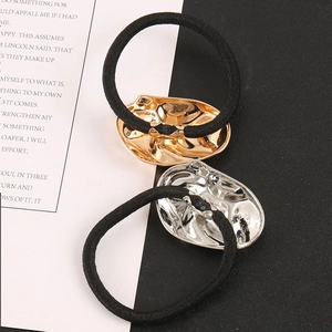 Minimalist geometric metal hair tie set with gold and silver oval wave textured plates