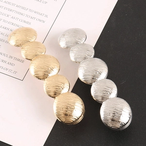 Minimalist metal hair clips with grooved texture in gold and silver plating