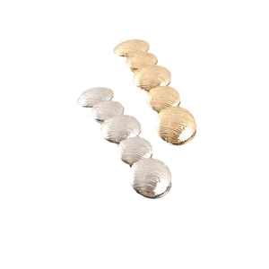 Minimalist gold and silver metallic spring hair clips with textured pleated stripe design
