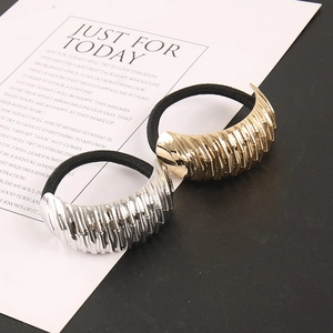 Detail of high-elasticity hair ties with gold and silver bamboo-textured metal buckles