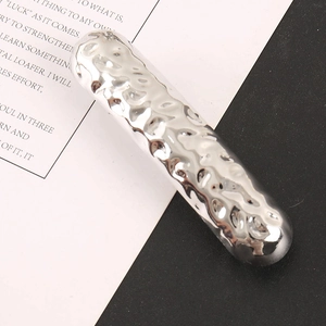 Detailed view of silver minimalist alloy hair clip with polished water ripple texture design