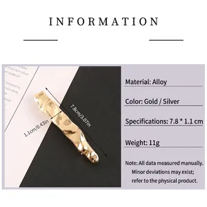 Minimalist geometric alloy hair clip in gold and silver finish with wave texture