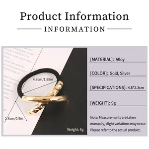 Golden geometric metal hair tie with hammered texture and black elastic for women