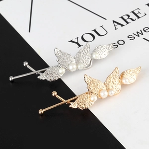 Elegant gold and silver leaf hair clips with white pearls and detailed texture