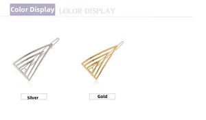 Detail view of geometric hollow triangle hair clips in polished gold and silver metal