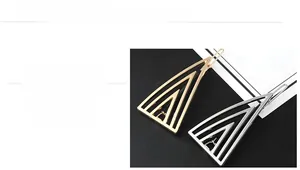 Detailed close-up showing geometric hollow triangle hair clips with mirror polished finish