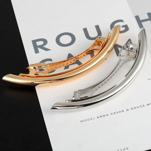Minimalist metallic curved hair clip set in polished gold and silver finishes