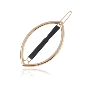 Fermaglio per capelli minimalista in metallo dorato con barra centrale nera opaca su bianco