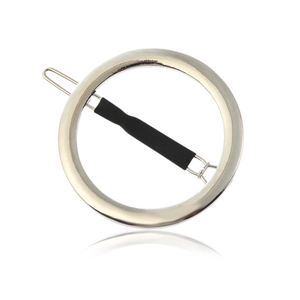 Minimalist silver round metal hair clip with black pin for women on white background