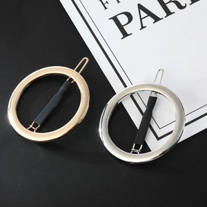 Minimalist gold and silver circular hollow alloy hair clips set on black background