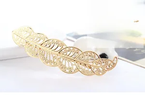 Detailed macro view of the hollow metal leaf hair clip with elegant golden plating