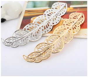 Detailed view of hollow out leaf metal hair clips in gold and silver plated finish