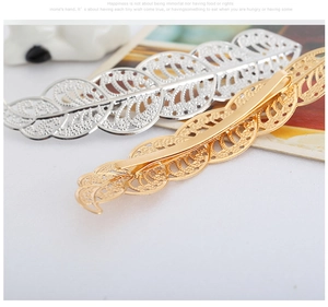 Detailed view of hollow leaf hairpins in gold and silver plating with sleek metal finish