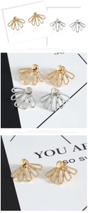 Detailed view of fan-shaped radiating stud earrings in polished gold and silver finishes