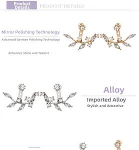 Detailed view of leaf-shaped stud earrings with crystal inlay and mirror-polished finish