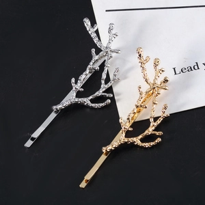 Minimalist branch hair clips in gold and silver finish with realistic metal bark texture