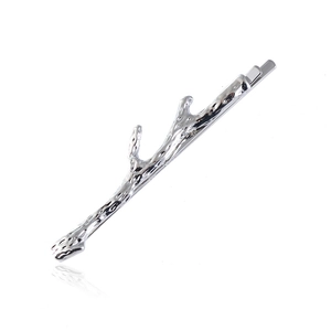 Silver branch hair clip with textured matte finish on a clean white background
