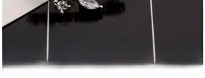 Macro detail showing crystal leaf ear crawler with fine silver plating and marquise zircon setting