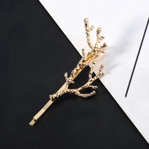 Minimalist golden tree branch hair clip for women with textured metal coral design