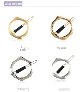 Detailed view of irregular geometric hair clips in matte gold, silver, and KC gold finishes