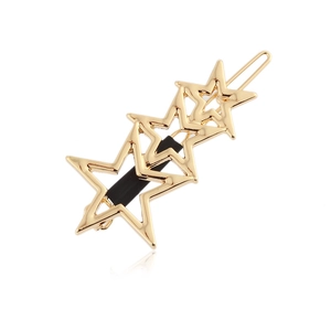 Polished gold metal hair clip featuring a minimalist hollow triple star geometric design