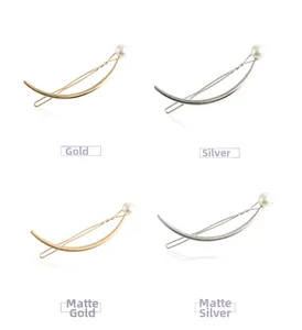 Polished and matte metal arc hair clips in gold and silver with pearl accents